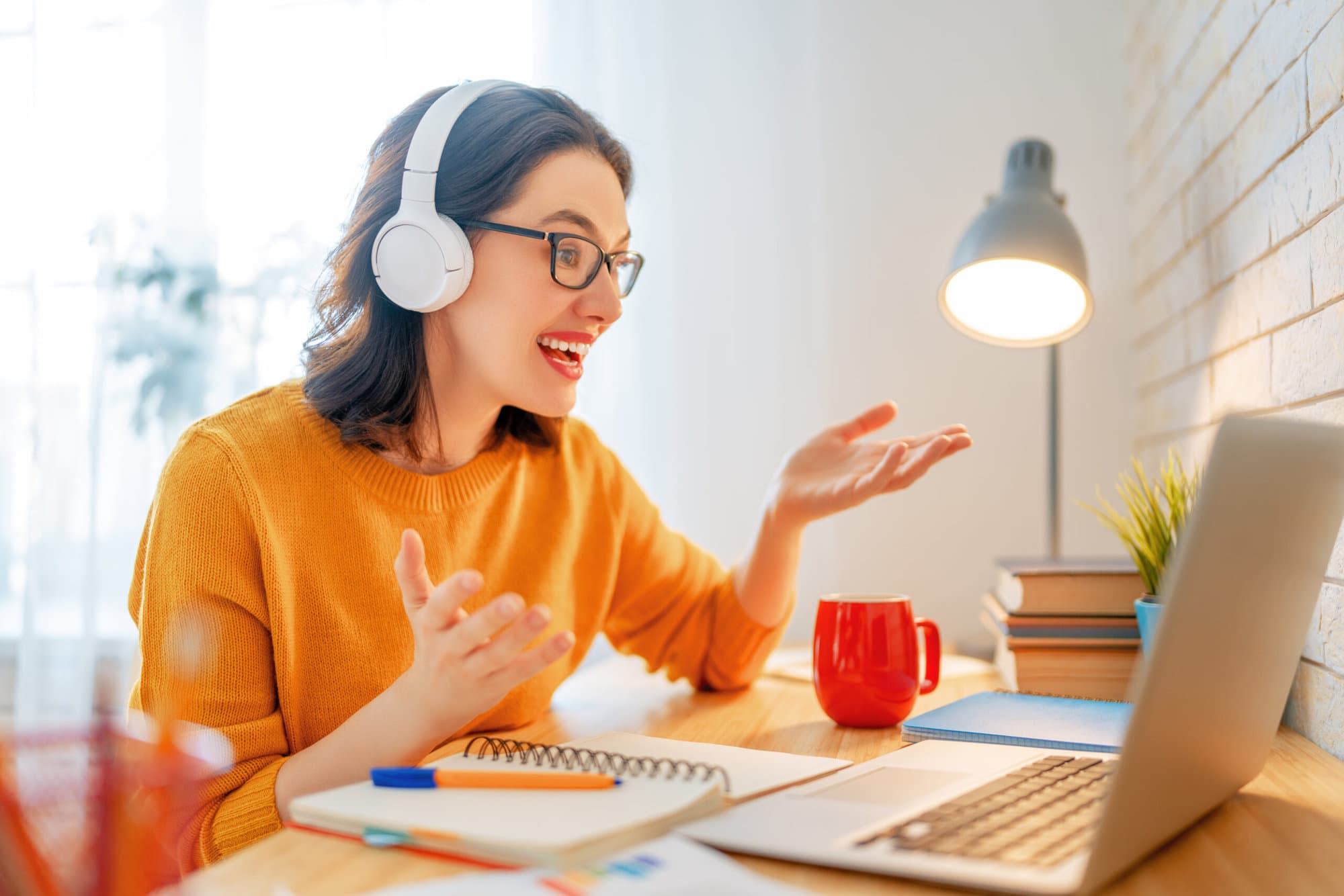 A woman having a warm, focused online counselling session at home